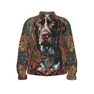 May include: A denim jacket with a colorful floral pattern and a brown and white dog's face in the center.