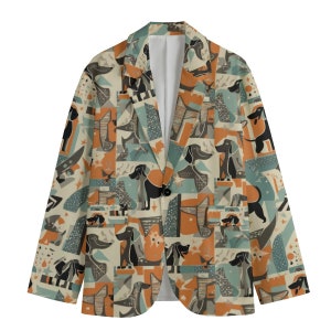 May include: A beige blazer with a pattern of black and brown dogs on a white background. The dogs are in various poses and sizes, and the pattern is repeated throughout the fabric.