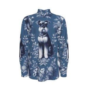 May include: Blue button-down shirt with a repeating pattern of a Schnauzer dog illustration. The dog is in black, white, and grey, set against white floral and foliage elements. The shirt has long sleeves and a classic collar.