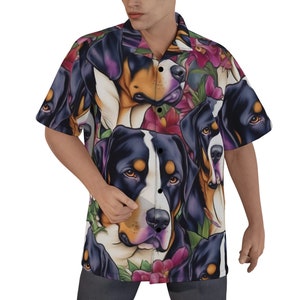 May include: A white button-up shirt with a short sleeve design featuring a repeating pattern of Bernese Mountain Dog faces and tropical flowers in shades of pink, purple, green, and orange.