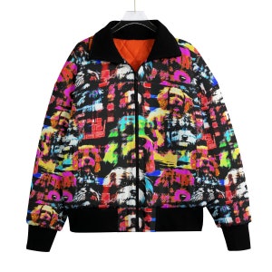 May include: A black bomber jacket with a colorful print of dogs. The print features a variety of dog breeds in different colors and poses.