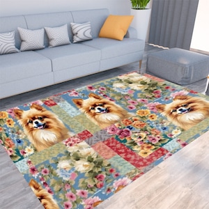 May include: A colorful patchwork rug with a floral design and images of Pomeranian dogs. The rug has a blue, green, red, and yellow color scheme.