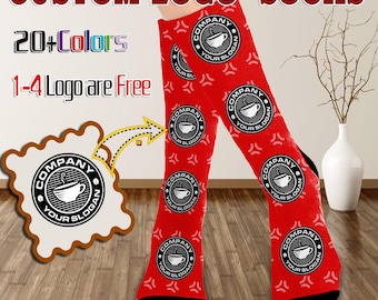 May include: Red custom logo socks with black heels and toes. The socks feature a repeating circular logo with a coffee cup design and the text "COMPANY YOUR SLOGAN". The text "CUSTOM LOGO SOCKS", "20+ Colors", and "1-4 Logo are Free" are also visible.