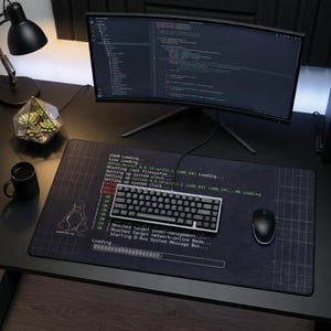 May include: A set of three ceramic mugs with a speckled, matte finish in cream, light grey, and dark grey. Each mug has a simple, minimalist design and a rounded handle. The mugs are stacked on top of each other.