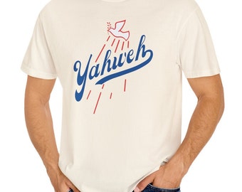 May include: A white t-shirt with a blue and red graphic design. The graphic features a white dove with an olive branch in its beak, flying above the word "Yahweh" in blue cursive lettering.