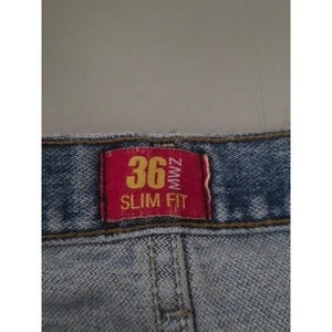 Calça jeans vintage Wrangler masculina, lavagem clara, corte slim, tamanho 36x32, azul, para trabalho e estilo western. imagem 8