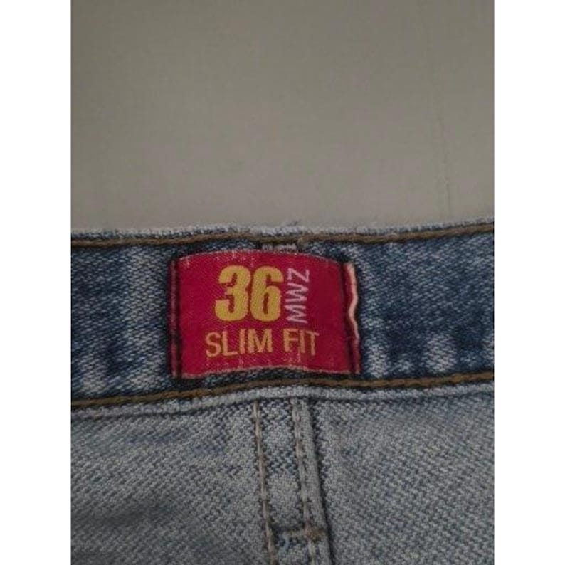 Calça jeans vintage Wrangler masculina, lavagem clara, corte slim, tamanho 36x32, azul, para trabalho e estilo western. imagem 8