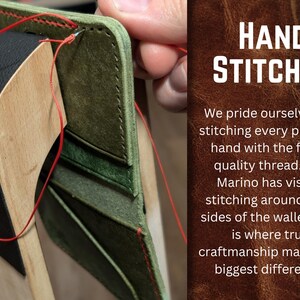 May include: Close-up of a hand-stitched leather wallet in progress. The wallet is olive green and black, with red thread used for the stitching. The text "HAND STITCHED" is visible in the background, emphasizing the craftsmanship.