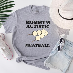 Camiseta Mommy Autistic Meatball - Roupa divertida e de apoio para conscientização sobre o autismo