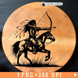 May include: A black and white silhouette of a Native American on horseback, riding through tall grass and aiming a bow and arrow. The image is on a round wooden surface.