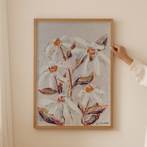 May include: A framed painting of white flowers with yellow centers on a light purple background. The flowers are painted in a loose, impressionistic style. The painting is signed "E. Christine" in the lower right corner.