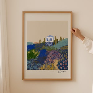 May include: A framed print of a painting depicting a white house with blue trim nestled in a landscape of green, blue, and yellow brushstrokes. The house is surrounded by trees and flowers. The artist's signature, "E. Christine", is in the bottom right corner.