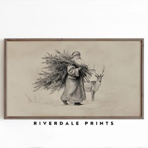 May include: A framed pencil sketch print featuring Santa Claus carrying a bundle of evergreen branches, with a deer standing nearby. The artwork is in a vintage style, with the text "RIVERDALE PRINTS" at the bottom.
