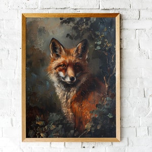 May include: Oil painting of a red fox with a white chest, framed in a light brown wooden frame. The fox is set against a dark, moody background with hints of green foliage. The artwork is displayed against a white brick wall.