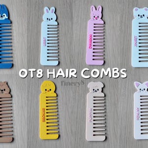 May include: Eight plastic hair combs featuring cartoon animal toppers and printed names: Wolf Chan, Leebit, Dwaekki, Jiniret, Han Quokka, Bbokari, PuppyM, and Foxlny. The text OT8 HAIR COMBS is centred above the bottom row of four colourful combs.