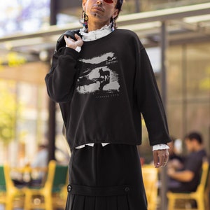 Young man wearing a customized black cotton sweatshirt from the movie Stalker  by  Tarkovski