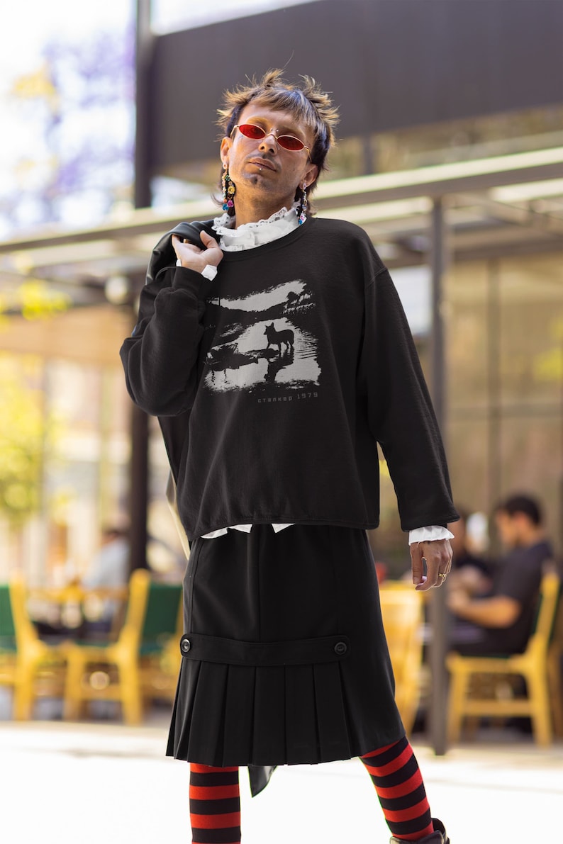 Young man wearing a customized black cotton sweatshirt from the movie Stalker  by  Tarkovski