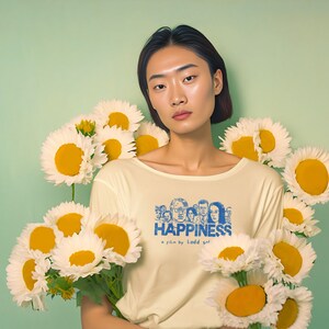Young woman wearing a customized yellow cotton T-shirt from the movie Happiness by Todd Solondz