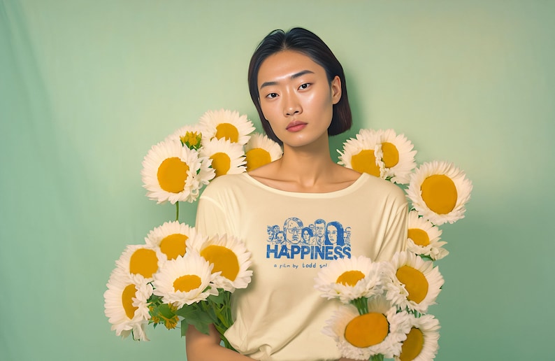 Young woman wearing a customized yellow cotton T-shirt from the movie Happiness by Todd Solondz