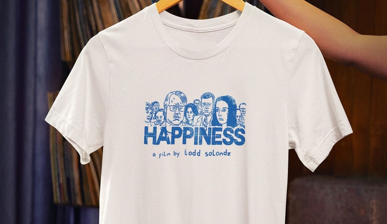Customized white t-shirt from the movie Happiness by Todd Solondz hanging on a hanger