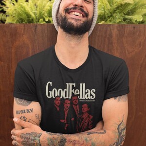 Young man wearing a customized black cotton shirt from the movie Goodfellas by Martin Scorsese