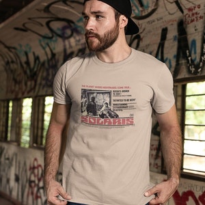 Young man wearing a customized sand cotton T-shirt from the movie Solaris  by  Tarkovski