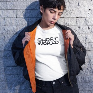 Young woman wearing a customized white cotton shirt from the movie Ghost World by Terry Zwigoff