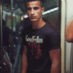 Young man wearing a customized black cotton shirt from the movie Goodfellas by Martin Scorsese
