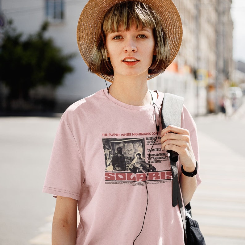 Young man wearing a customized pink cotton T-shirt from the movie Solaris  by  Tarkovski