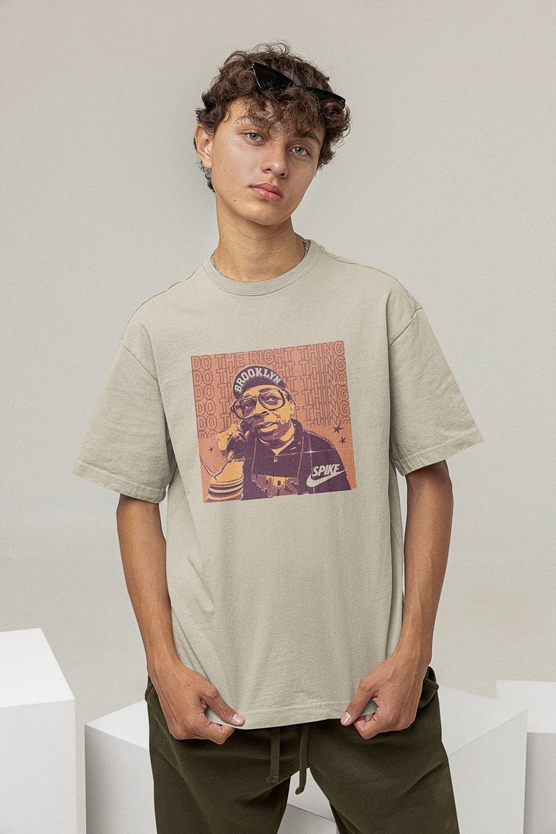 Young man wearing a sand cotton T-shirt Spike Lee Inspired