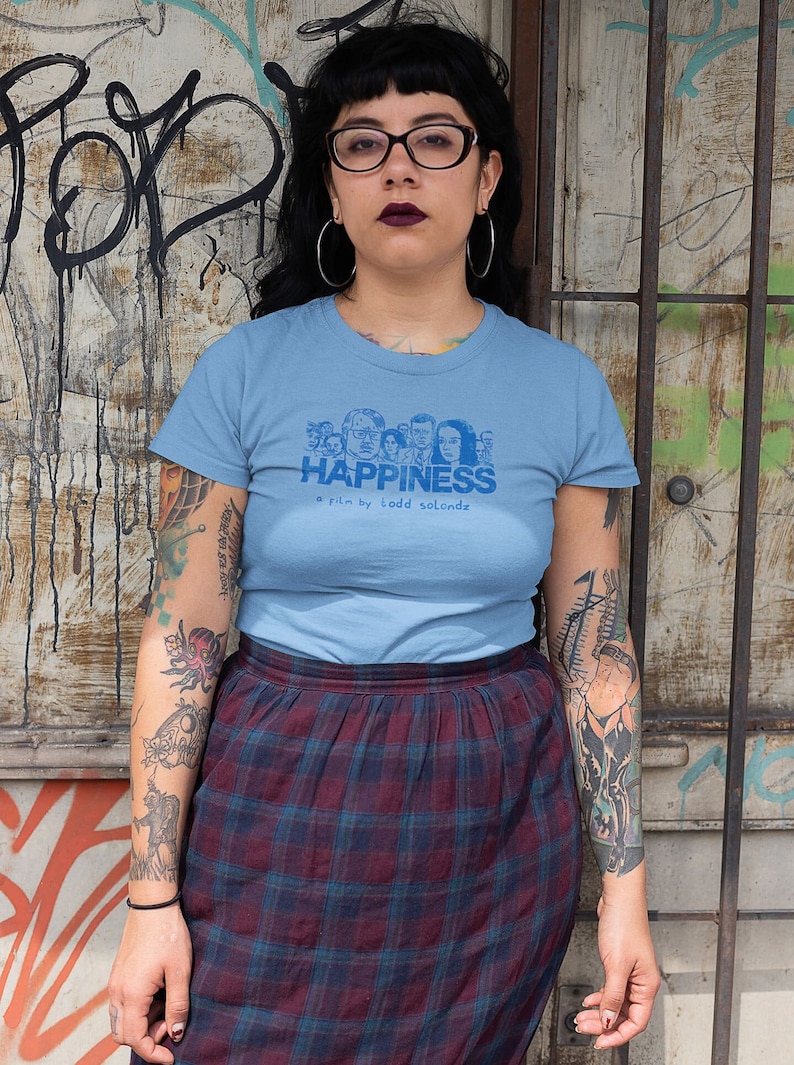 Young woman wearing a customized blue cotton T-shirt from the movie Happiness by Todd Solondz