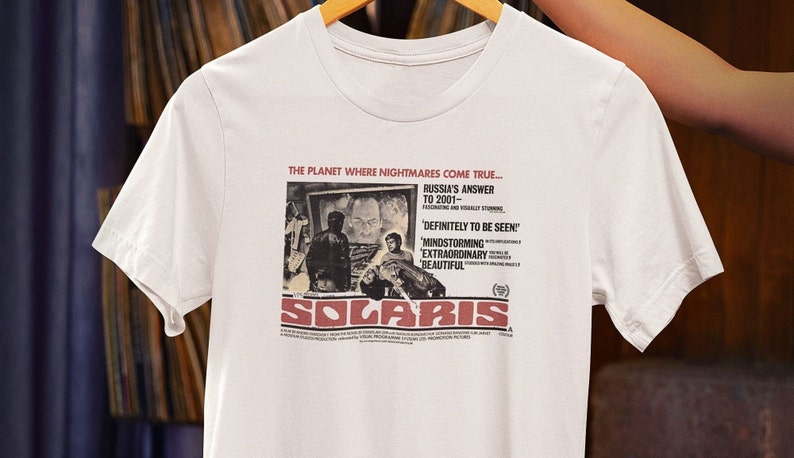 Customized white T-shirt from the movie Solaris by Tarkovski hanging on a hanger
