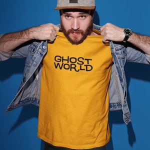 Young man wearing a customized gold cotton shirt from the movie Ghost World by Terry Zwigoff