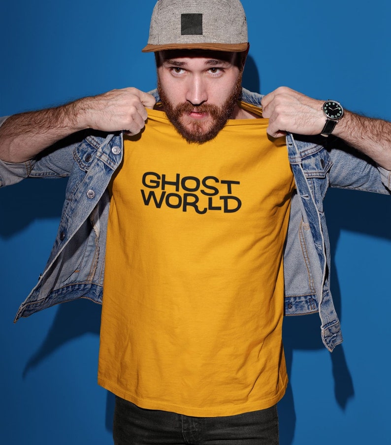 Young man wearing a customized gold cotton shirt from the movie Ghost World by Terry Zwigoff