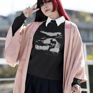 Young woman wearing a customized black cotton sweatshirt from the movie Stalker  by  Tarkovski