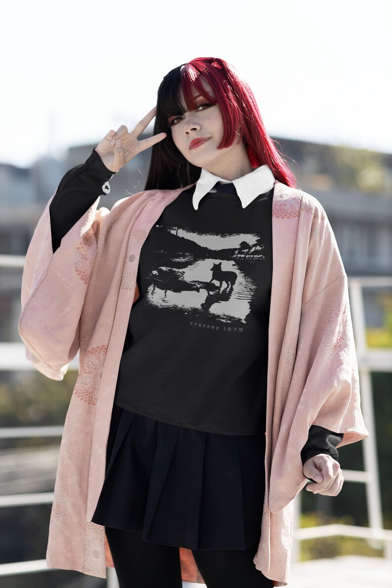 Young woman wearing a customized black cotton sweatshirt from the movie Stalker  by  Tarkovski