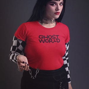 Young woman wearing a customized red cotton shirt from the movie Ghost World by Terry Zwigoff