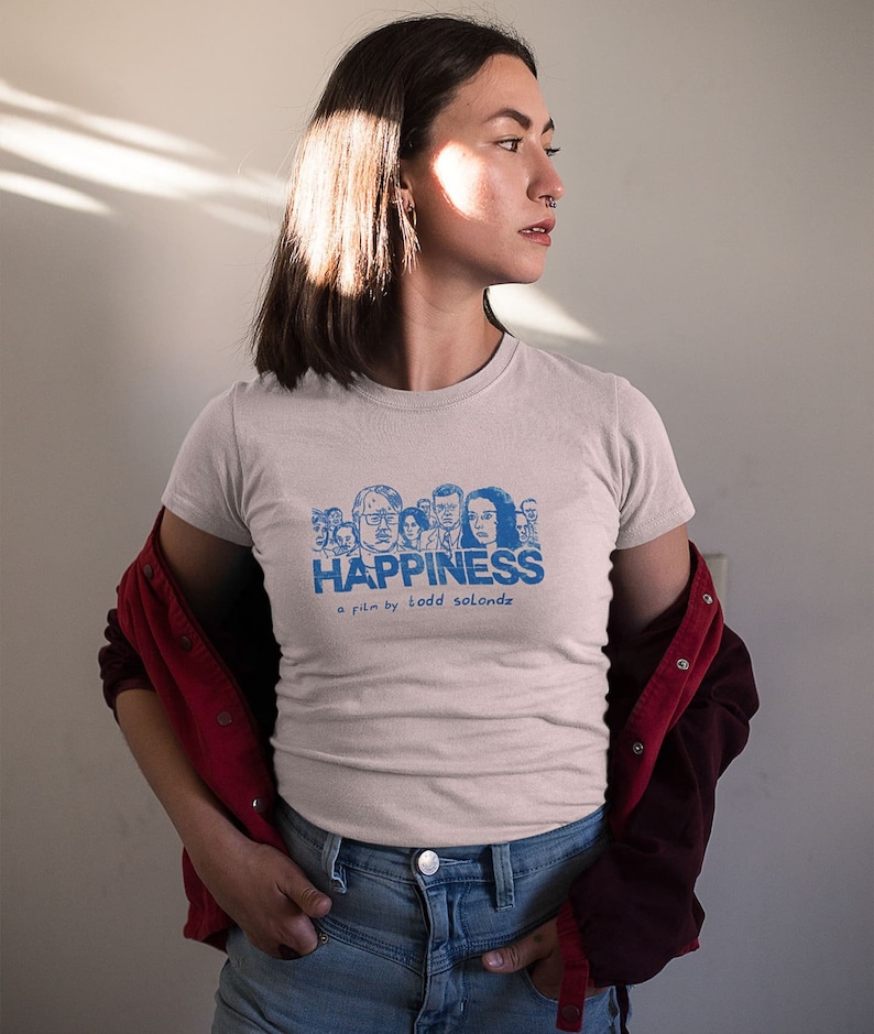 Young woman wearing a customized pink cotton T-shirt from the movie Happiness by Todd Solondz