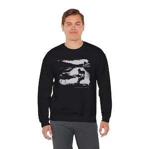 Young man wearing a customized black cotton sweatshirt from the movie Stalker  by  Tarkovski