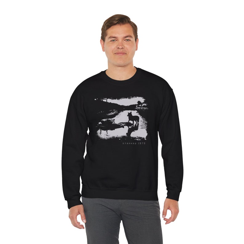 Young man wearing a customized black cotton sweatshirt from the movie Stalker  by  Tarkovski