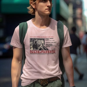 Young man wearing a customized pink cotton T-shirt from the movie Solaris  by  Tarkovski