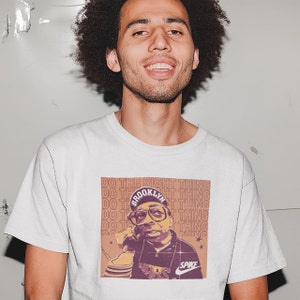 Young man wearing a white cotton T-shirt Spike Lee Inspired
