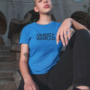 Young woman wearing a customized blue cotton shirt from the movie Ghost World by Terry Zwigoff