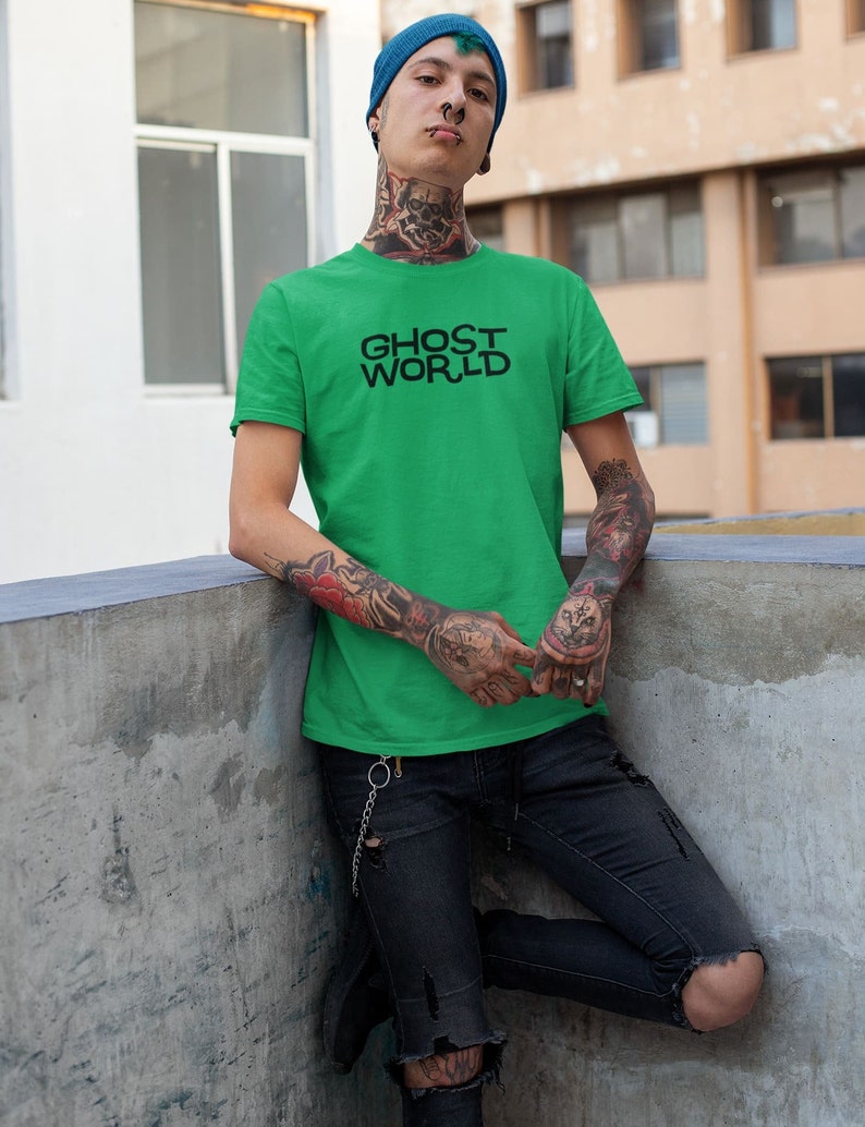 Young man wearing a customized green cotton shirt from the movie Ghost World by Terry Zwigoff
