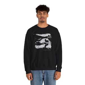 Young man wearing a customized black cotton sweatshirt from the movie Stalker  by  Tarkovski