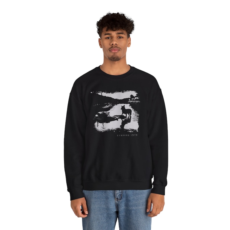 Young man wearing a customized black cotton sweatshirt from the movie Stalker  by  Tarkovski