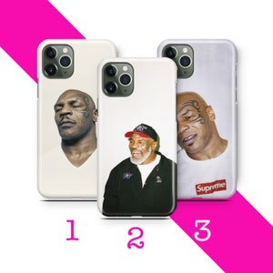 May include: Three white iPhone cases with different images of Mike Tyson. The first case features a close-up of Tyson's face. The second case features Tyson wearing a red hat and a black jacket. The third case features Tyson wearing a white t-shirt with the word "Supreme" printed on it.