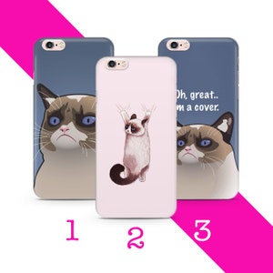May include: Three iPhone cases with different designs featuring a grumpy cat. The first case shows the cat looking directly at the viewer. The second case shows the cat hanging from a ledge. The third case shows the cat looking at the viewer with the text "Oh, great. I'm a cover."