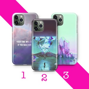 May include: Three different phone cases with unique designs. The first case has a purple and blue sky with clouds and the text "Your time will come if you wait for it". The second case has a diamond-shaped crystal with a blue and green gradient. The third case has a light green background with purple and pink crystal formations.