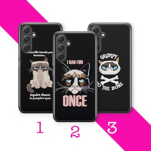 May include: Three black phone cases with different Grumpy Cat designs. The first case features Grumpy Cat with the text "When life hands you lemons... Squirt them in people's eyes." The second case features Grumpy Cat with the text "I had fun once." The third case features Grumpy Cat with the text "Grumpy to the bone."